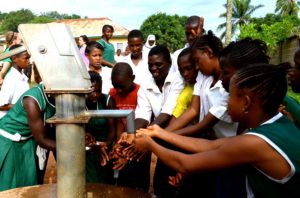 Students using a fresh water pump.